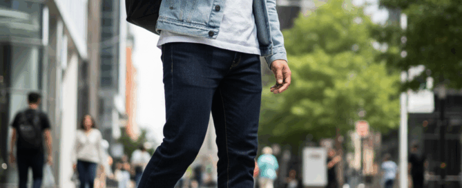 best nike white sneakers. A stylish man is standing, wearing a casual outfit and white Nike sneakers.